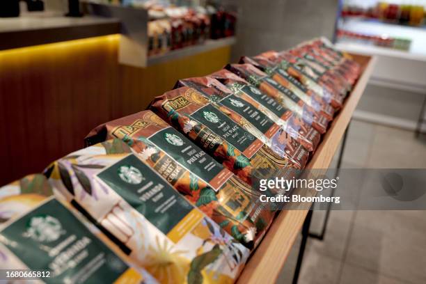 Bags of coffee for sale at a Starbucks location in New York, US, on Thursday, Aug. 17, 2023. Starbucks Corp. Spending billions of dollars to shave...