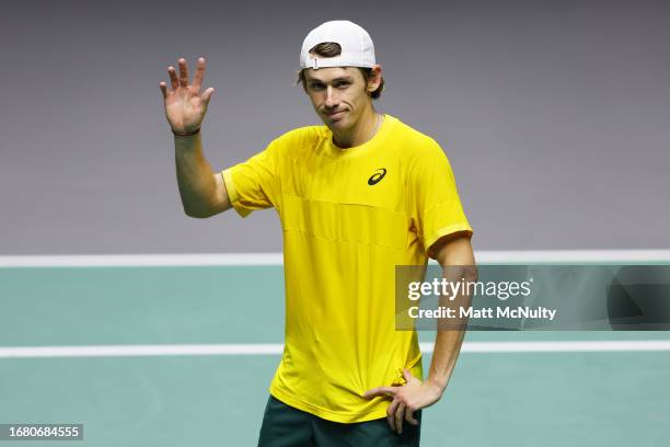 Alex de Minaur of Team Australia waves to fans after winning the singles match against Ugo Humbert of Team France during the Davis Cup Finals Group...