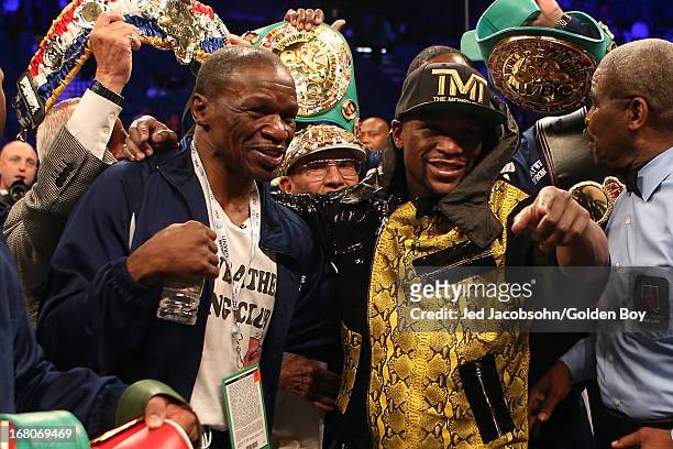 Trainer Floyd Mayweather Sr. And boxer Floyd Mayweather Jr. Celebrate Mayweather Jrs. Unanimous decision victory against Robert Guerrero in their WBC...