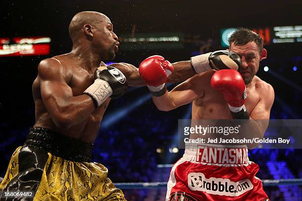 Floyd Mayweather Jr. Connects with a left to the face of Robert Guerrero in their WBC welterweight title bout at the MGM Grand Garden Arena on May 4,...