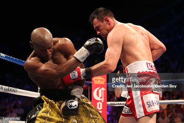 Robert Guerrero throws a left to the body of Floyd Mayweather Jr. In their WBC welterweight title bout at the MGM Grand Garden Arena on May 4, 2013...