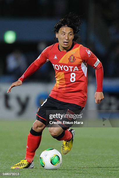 Jungo Fujimoto of Nagoya Grampus in action during the J.League match between Kawasaki Frontale and Nagoya Grampus at Todoroki Stadium on May 3, 2013...
