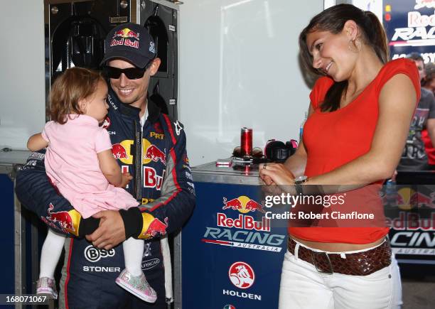 Casey Stoner driver of the Red Bull Pirtek Holden is seen with his wife Adriana and baby daughter Alessandra Maria prior to round two of the V8...