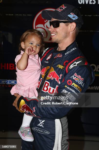 Casey Stoner driver of the Red Bull Pirtek Holden is seen with his daughter Alessandra Maria prior to round two of the V8 Supercars Dunlop...