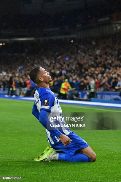 Brighton's Brazilian striker Joao Pedro celebrates scoring his team first goal during the UEFA Europa League Group B football match between Brighton...