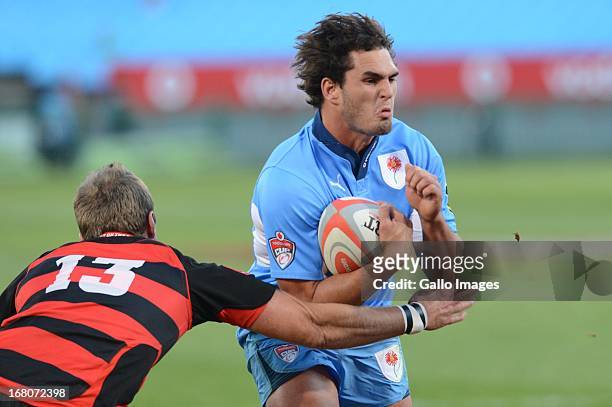 Dries Swanepoel of Blue Bulls tackled by Wayne Stevens of Eastern Province Kings during the Vodacom Cup Quarter Final match between Vodacom Blue...
