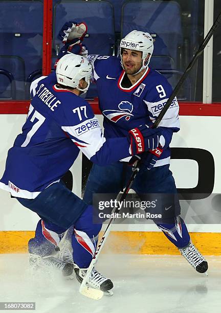 Damien Fleury of France celebrate with team mate Sacha Treille after he scores his team's opening goal during the IIHF World Championship group H...