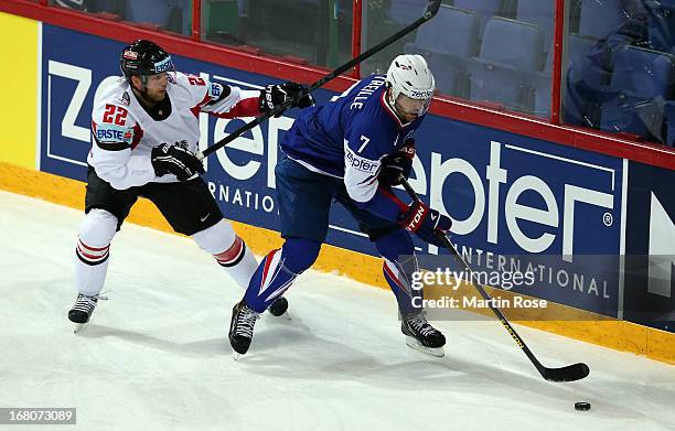 Yorick Treille of France and Thomas Pock of Austria battle for the puck during the IIHF World Championship group H match between France and Austria...