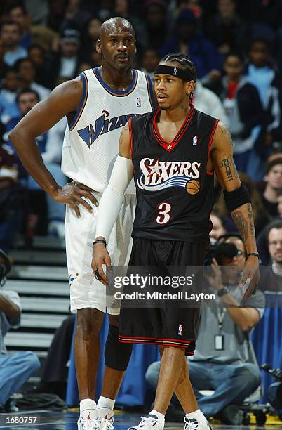 Allen Iverson of the Philadelphia 76ers on the court with Michael Jordan of the Washington Wizards during the NBA game at MCI Center on November 30,...