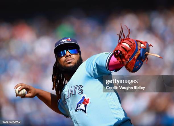 Vladimir Guerrero Jr. #27 of the Toronto Blue Jays throws a ball to fans against the Washington Nationals at Rogers Centre on August 30, 2023 in...