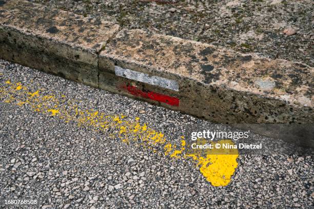 painted  cami de cavalls sign on sidewalk, coastal trail, north coast, minorca - cavalls stock pictures, royalty-free photos & images