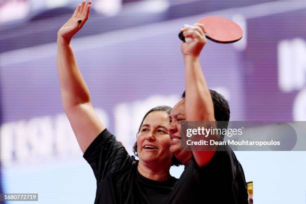 Stacey Adam and Paulette Doctor of New Zealand embrace following the Women's Singles TT7 Bronze Medal match between Team New Zealand and Team New...