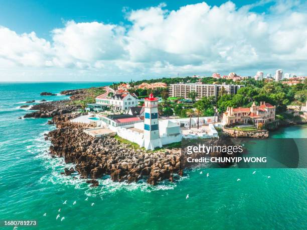 drone view of lighthouse at the coast of cascais - backdrop projection of beach stock pictures, royalty-free photos & images
