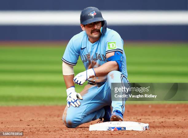 Davis Schneider of the Toronto Blue Jays looks on after being tagged out at second base against the Washington Nationals at Rogers Centre on August...