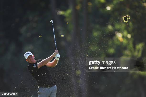 Tom Hoge of the United States plays his second shot on the 16th hole during Day One of the BMW PGA Championship at Wentworth Golf Club on September...