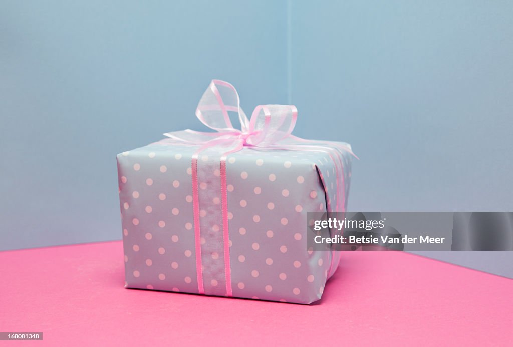 Present with pink ribbon.