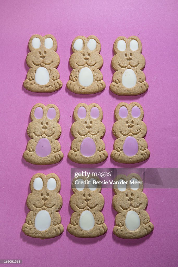 Easter bunny cookies on pink background.