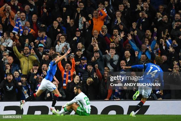 Rangers' English defender Ben Davies and Rangers' Dutch striker Sam Lammers celebrate their team first goal scored by Rangers' Senegalese striker...