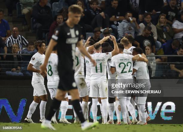 Sporting's players celebrate scoring during the UEFA Europa League Group D football match between Sturm Graz and Sporting Lisbon in Graz, on...
