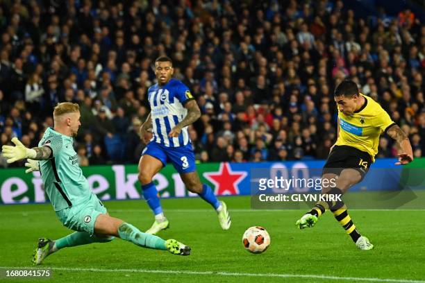 S Argentinian forward Ezequiel Ponce shoots and scores his team third goal during the UEFA Europa League Group B football match between Brighton and...