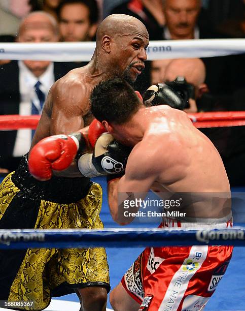 Floyd Mayweather Jr. Hits Robert Guerrero during the seventh round of their WBC welterweight title bout at the MGM Grand Garden Arena on May 4, 2013...