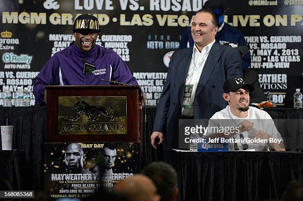 Floyd Mayweather Jr. Speaks to the media on stage with CEO of Golden Boy Promotions Richard Schaefer and Robert Guerrero during the news conference...