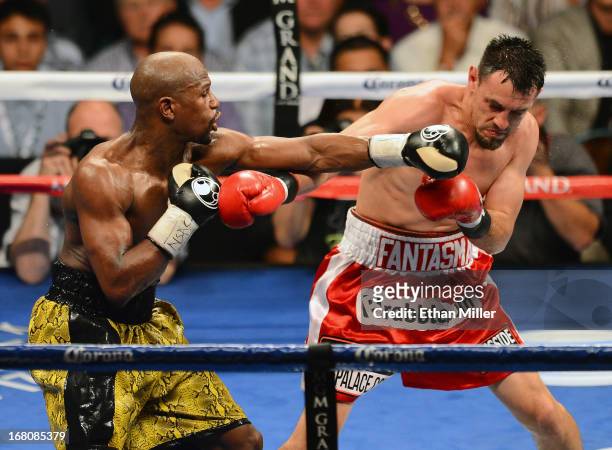 Floyd Mayweather Jr. Throws a left at Robert Guerrero during the fifth round of their WBC welterweight title bout at the MGM Grand Garden Arena on...