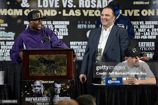 Floyd Mayweather Jr. Speaks to the media on stage with CEO of Golden Boy Promotions Richard Schaefer and Robert Guerrero during the news conference...