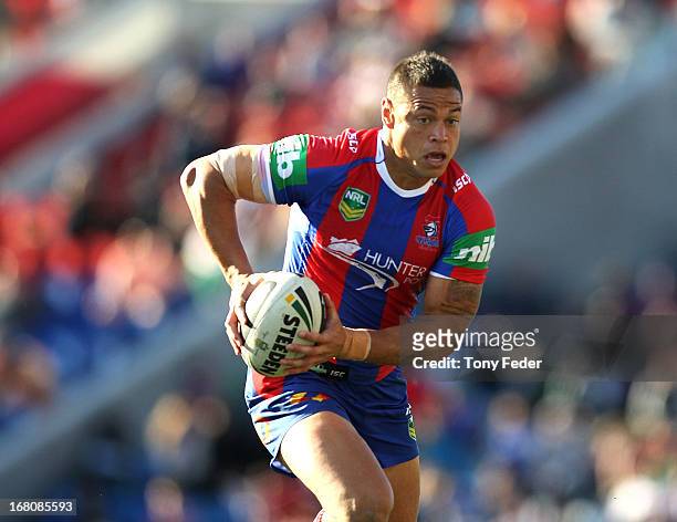 Timana Tahu of the Knights runs with the ball during the round eight NRL match between the Newcastle Knights and the Cronulla Sharks at Hunter...