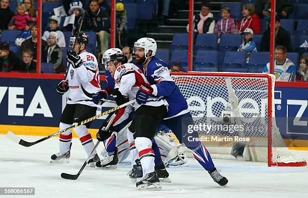 Antonin Manavian of France battles for position with Thomas Vanek of Austria during the IIHF World Championship group H match between France and...
