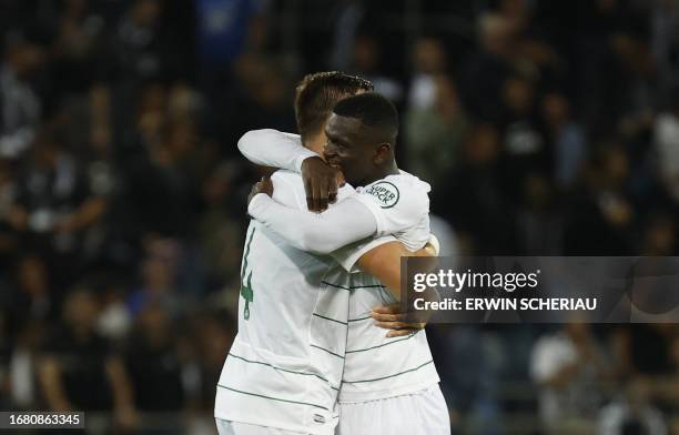 Sporting Lisbon's Uruguayan defender Sebastian Coates and Sporting Lisbon's Ivorian defender Ousmane Diomande celebrate during the UEFA Europa League...