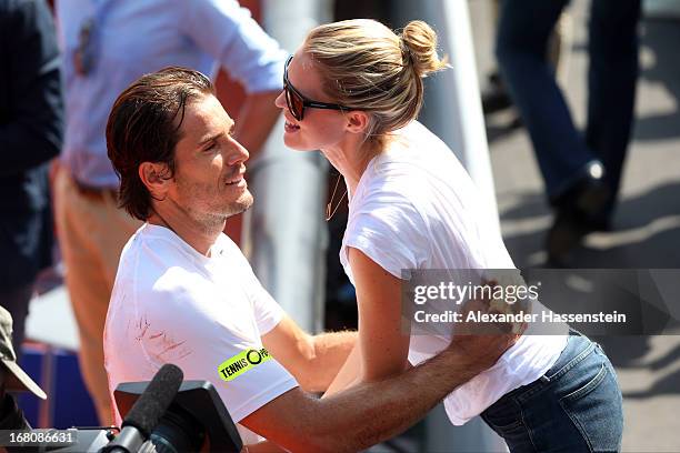 Tommy Haas of Germany celebrates with his wife Sara Foster after winning his final match against Philipp Kohlschreiber of the BMW Open at Iphitos...