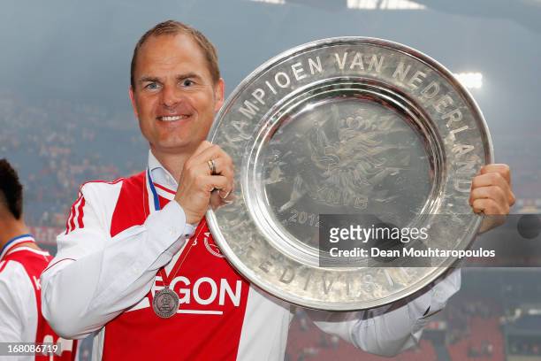 Ajax Coach / Manager, Frank de Boer poses with the Eredivisie Championship trophy after the match between Ajax and Willem II Tilburg at Amsterdam...
