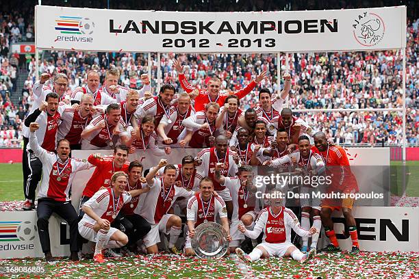 Ajax captain, Siem De Jong leads his teams celebrations with the Eredivisie Championship trophy after the match between Ajax and Willem II Tilburg at...