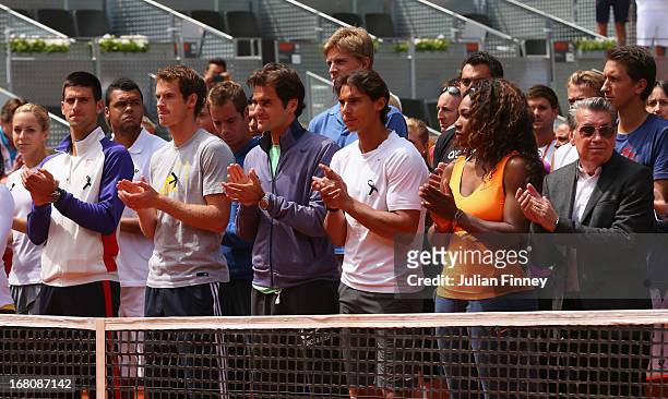 Tennis players including Novak Djokovic, Andy Murray, Roger Federer, Rafael Nadal and Serena Williams observe a moment of silence for Brad Drewett...
