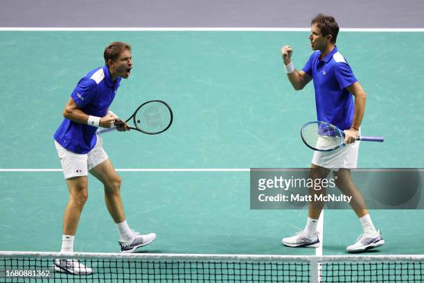 Edouard Roger-Vasselin of Team France celebrates after winning a point with doubles partner Nicolas Mahut during the Davis Cup Finals Group Stage...