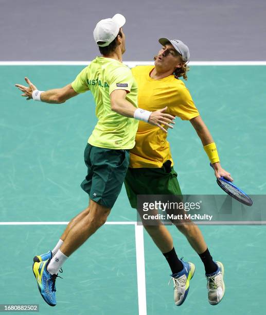 Matthew Ebden and Max Purcell of Team Australia celebrate with a chest bump after winning the doubles match against Edouard Roger-Vasselin and...