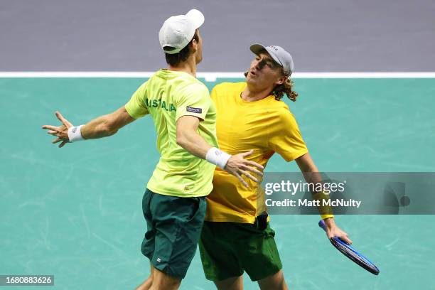 Matthew Ebden and Max Purcell of Team Australia celebrate with a chest bump after winning the doubles match against Edouard Roger-Vasselin and...