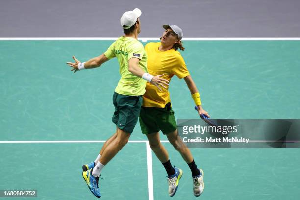 Matthew Ebden and Max Purcell of Team Australia celebrate with a chest bump after winning the doubles match against Edouard Roger-Vasselin and...