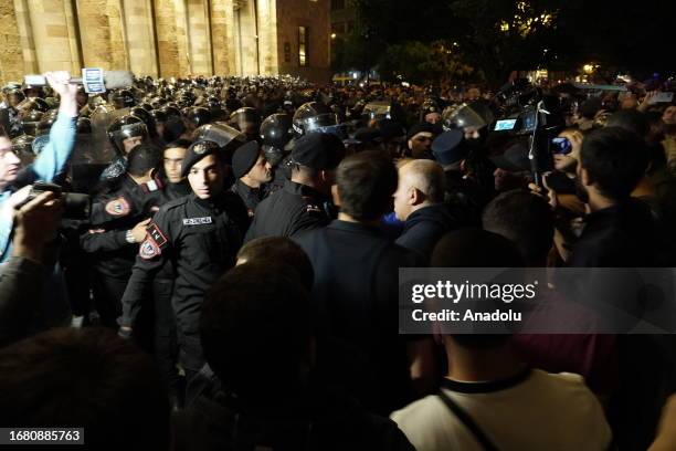 Armenian police officers stand guard as people stage anti-government protest at Republic Square in Yerevan, Armenia due to Azerbaijan's 'anti-terror...