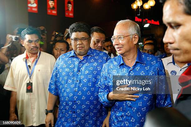 Malaysia's Prime Minister and Barisan Nasional chairman Najib Razak arrives at UMNO headquarters during election day on May 5, 2013 in Kuala Lumpur,...