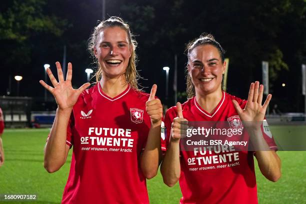 Marit Auee of FC Twente and Caitlin Dijkstra of FC Twente showing with their fingers the number 6, the amount of goals the players of FC twente shot...