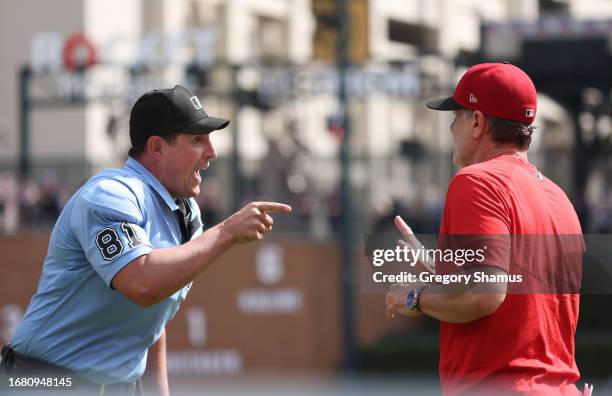 Manager David Bell of the Cincinnati Reds argues a call in the fourth inning with home playe umpire Quinn Wolcott at Comerica Park on September 14,...