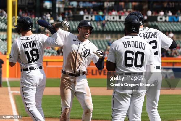 Matt Vierling of the Detroit Tigers celebrates his eighth inning grand slam home run with Tyler Nevin, Akil Baddoo and Parker Meadows while playing...