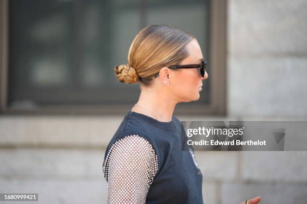 Guest wears sunglasses, earrings, outside Gabriela Hearst, during New York Fashion Week, on September 12, 2023 in New York City.