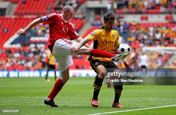 Stephen Wright of Newport battles with Andy Sandell of Newport during the Blue Square Bet Premier Conference Play-off Final match between Wrexham and...