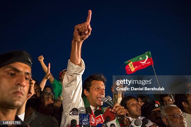 Imran Khan, chairman of the Pakistan Tehrik e Insaf party, addresses supporters during an election campaign rally on May 05, 2013 in Faisalabad,...