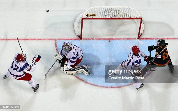 Semyon Varlamov , goaltender of Russia saves the shot of Felix Schuetz of Germany during the IIHF World Championship group H match between Germany...