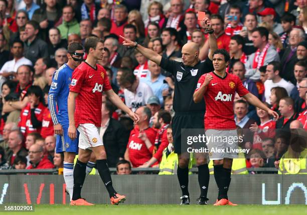 Rafael Da Silva of Manchester United is sent off by referee Howard Webb during the Barclays Premier League match between Manchester United and...