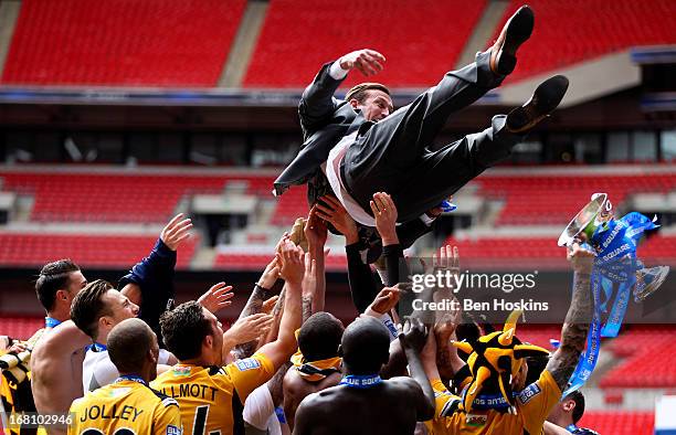 Newport manager Justin Edinburgh is thrown in the air by his players after the Blue Square Bet Premier Conference Play-off Final match between...